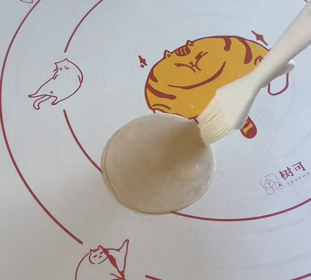 brush a thin, even layer of oil on each shee