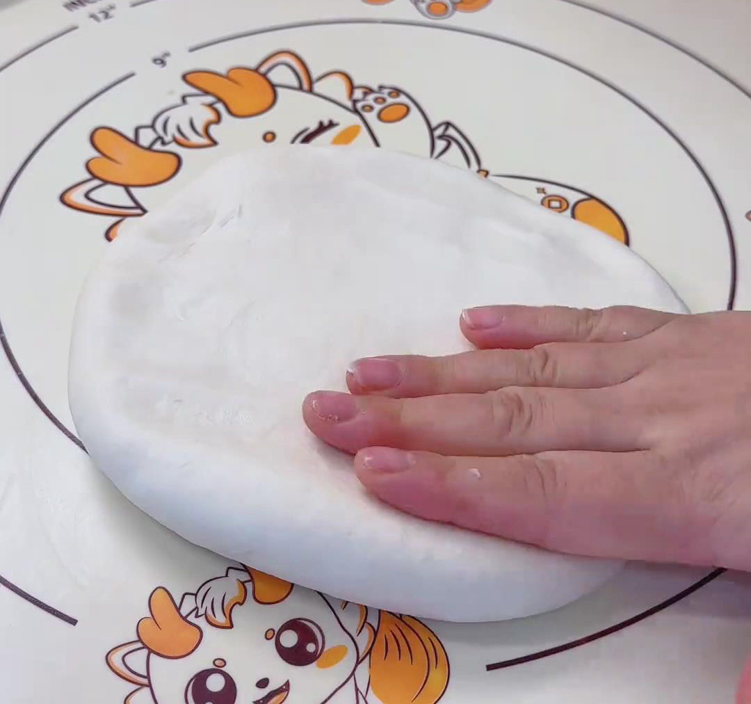 press it into a round disc about 20 cm in diameter press it into a round disc about 20 cm in diameter