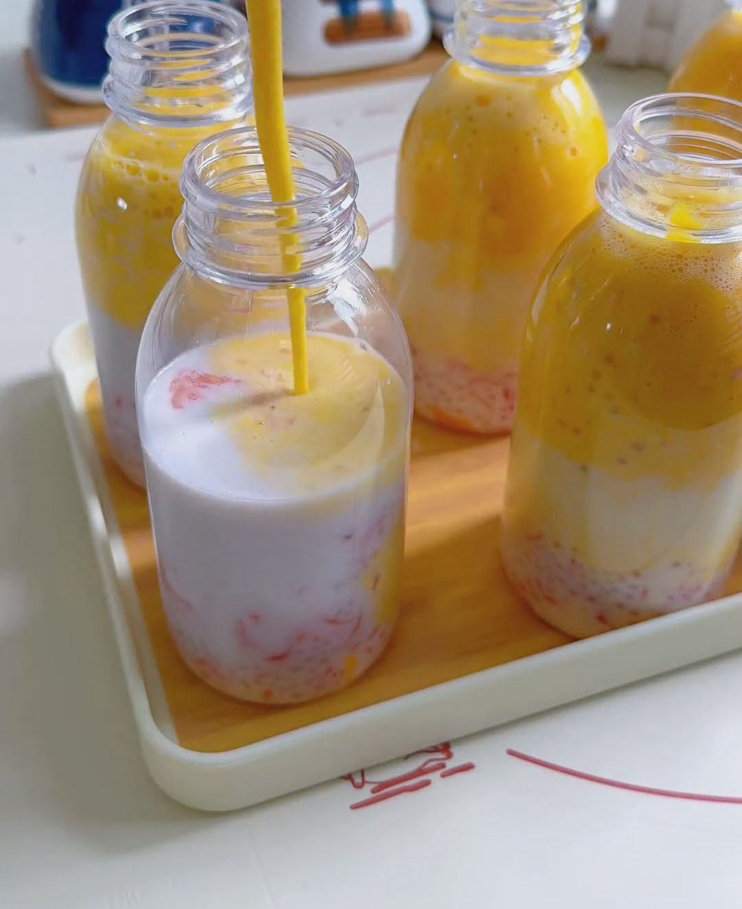 slowly pour or spoon the mango puree over the top