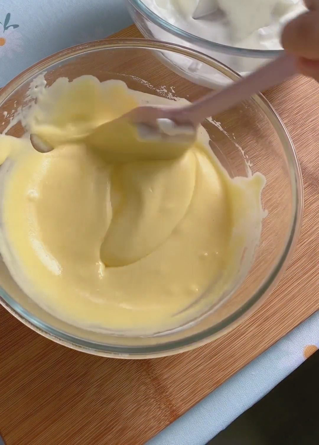 take about one third of the whipped meringue and add it to the yolk batter