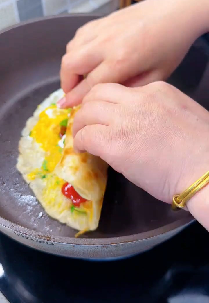 tightly roll the pancake from one end