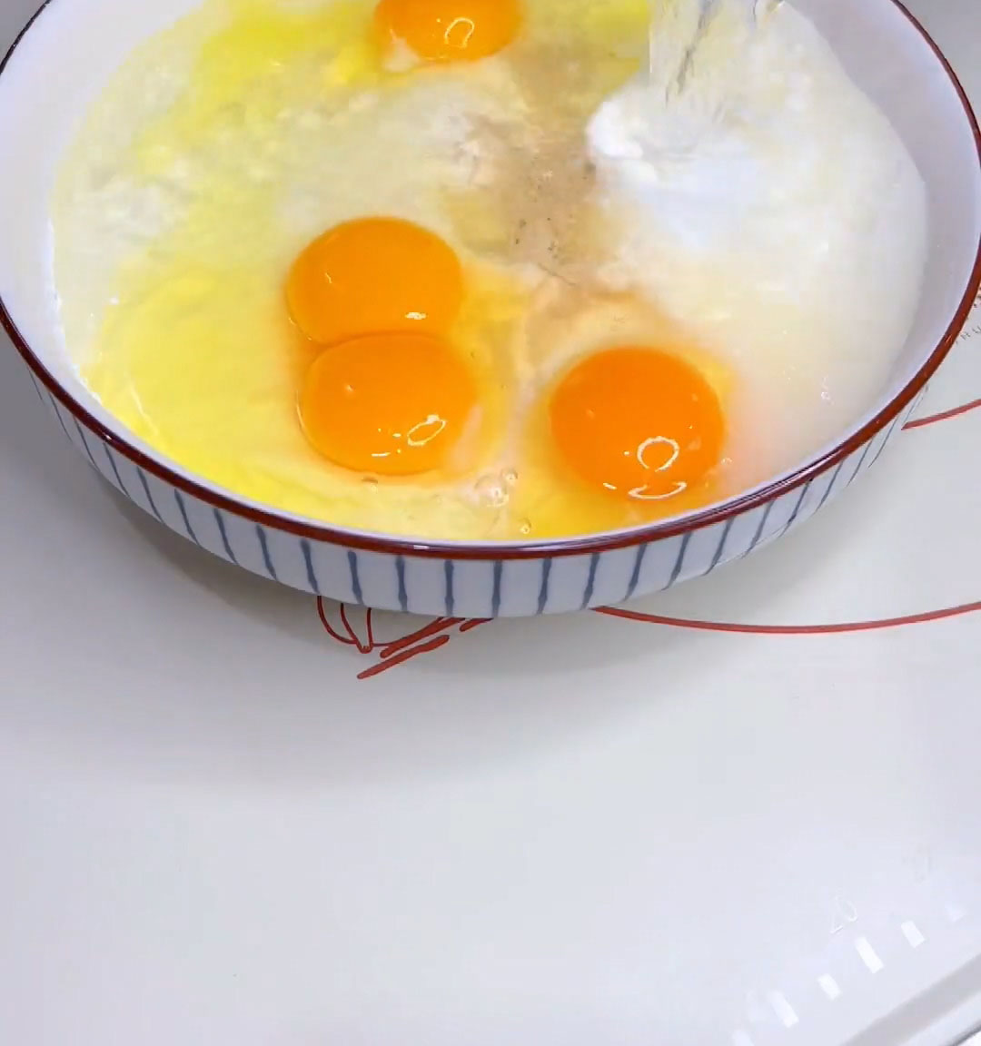 Add eggs and warm water to the dry ingredients