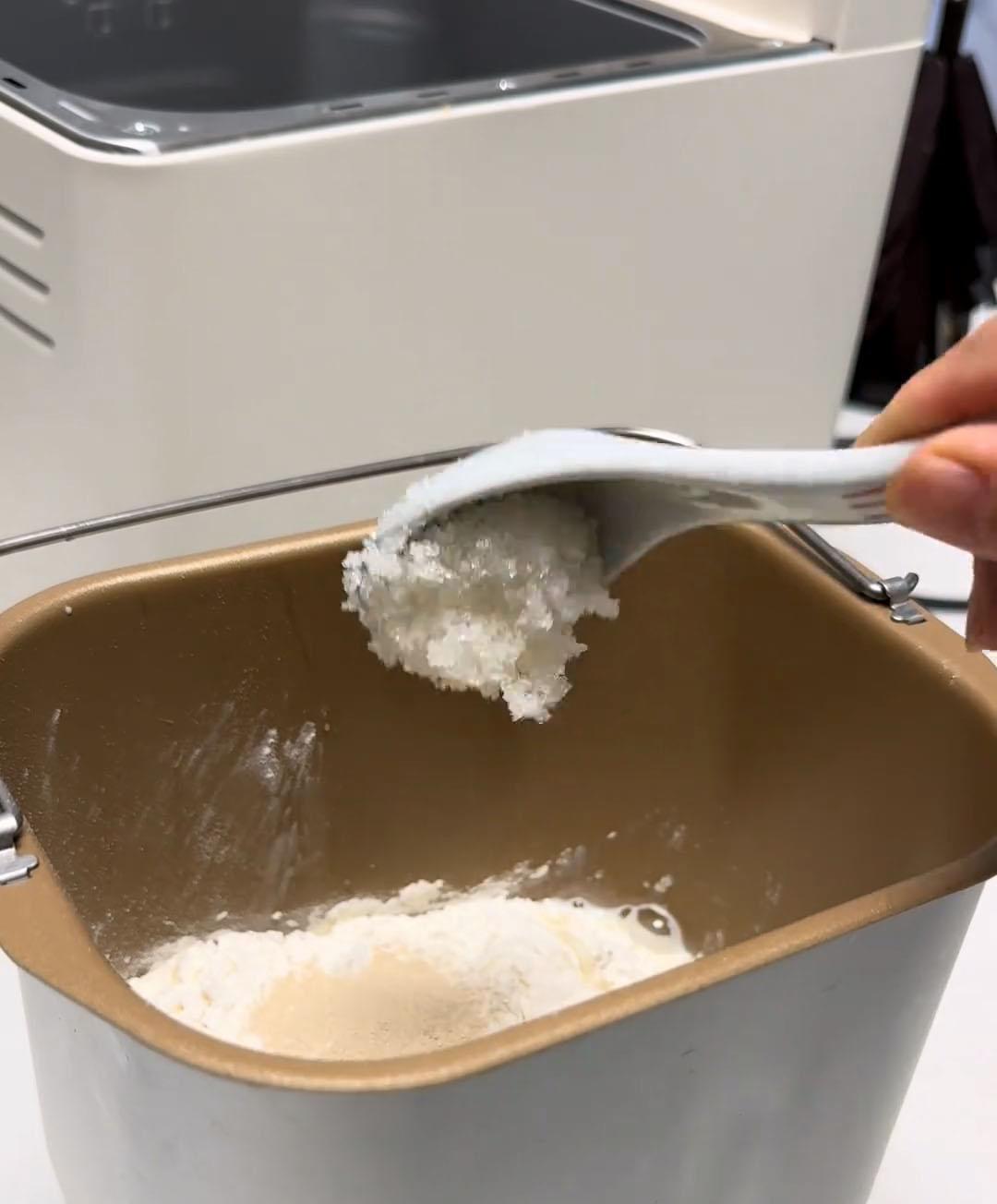 Add the refrigerated egg, milk, bread flour, sugar, and instant dry yeast into the bread machine pan