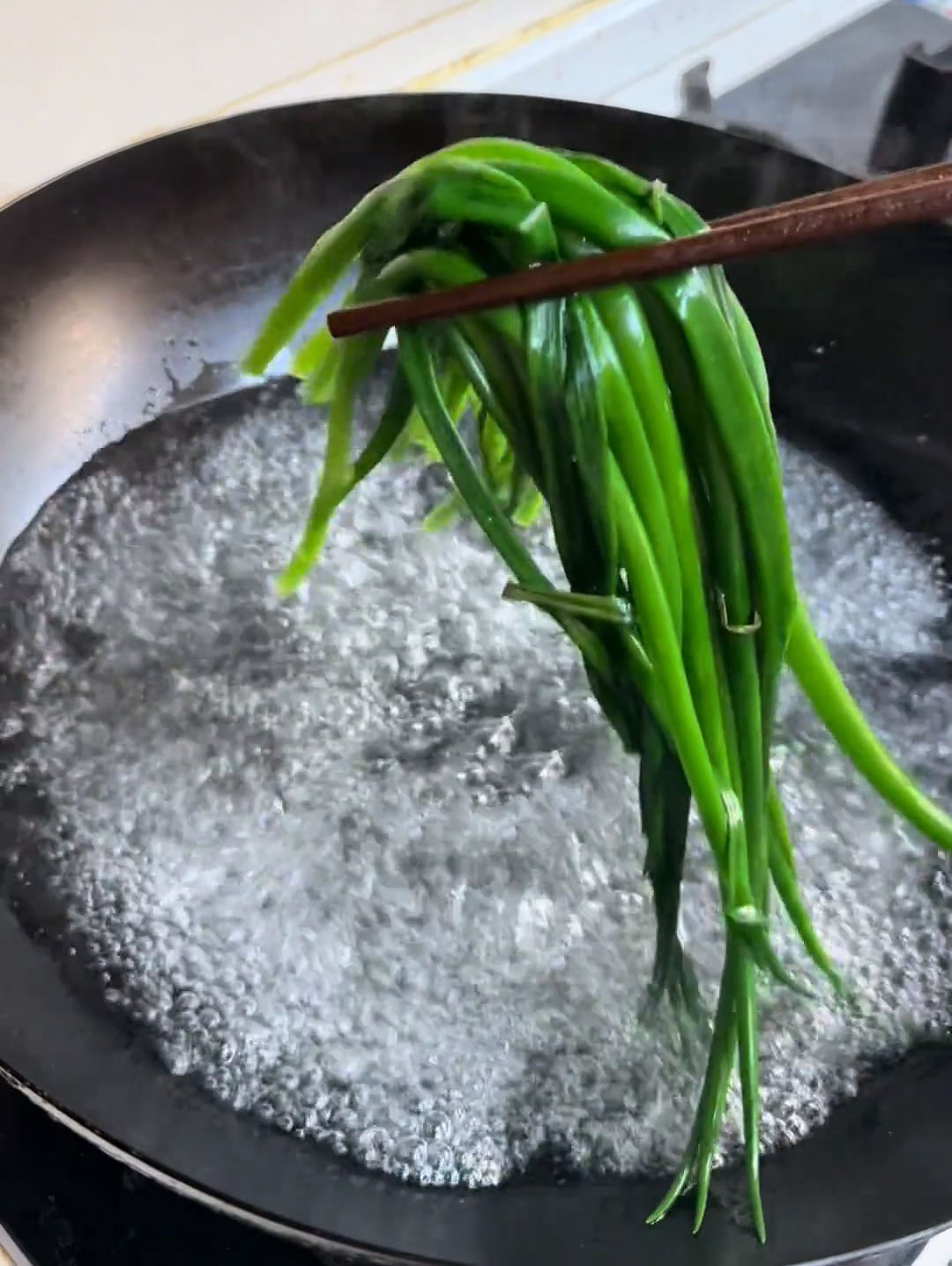 Add the scallions and blanch them for 10 seconds