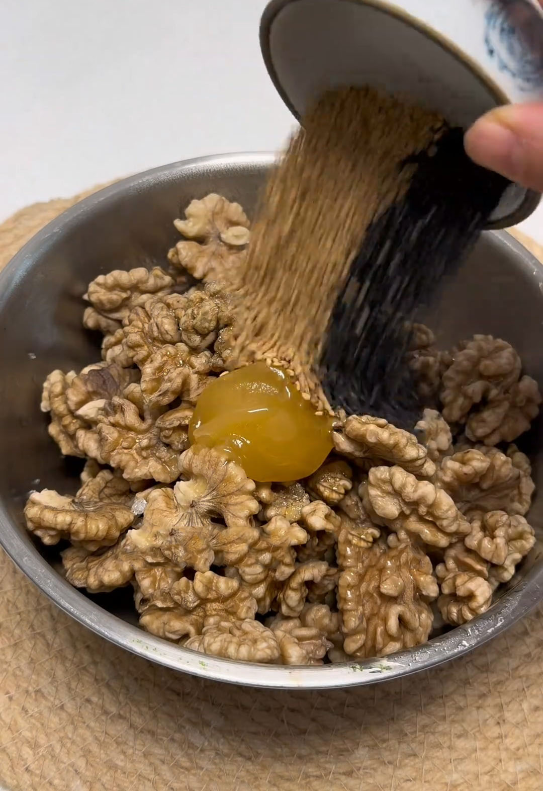 Add the white sugar, honey, and sesame seeds Add the white sugar, honey, and sesame seeds