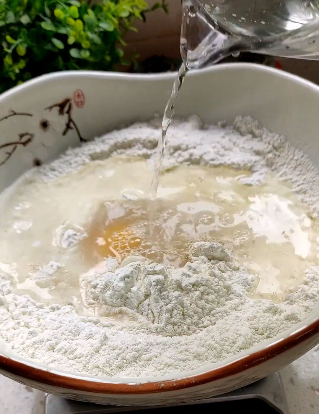 Add yeast and sugar, then crack in the egg and pour in warm water