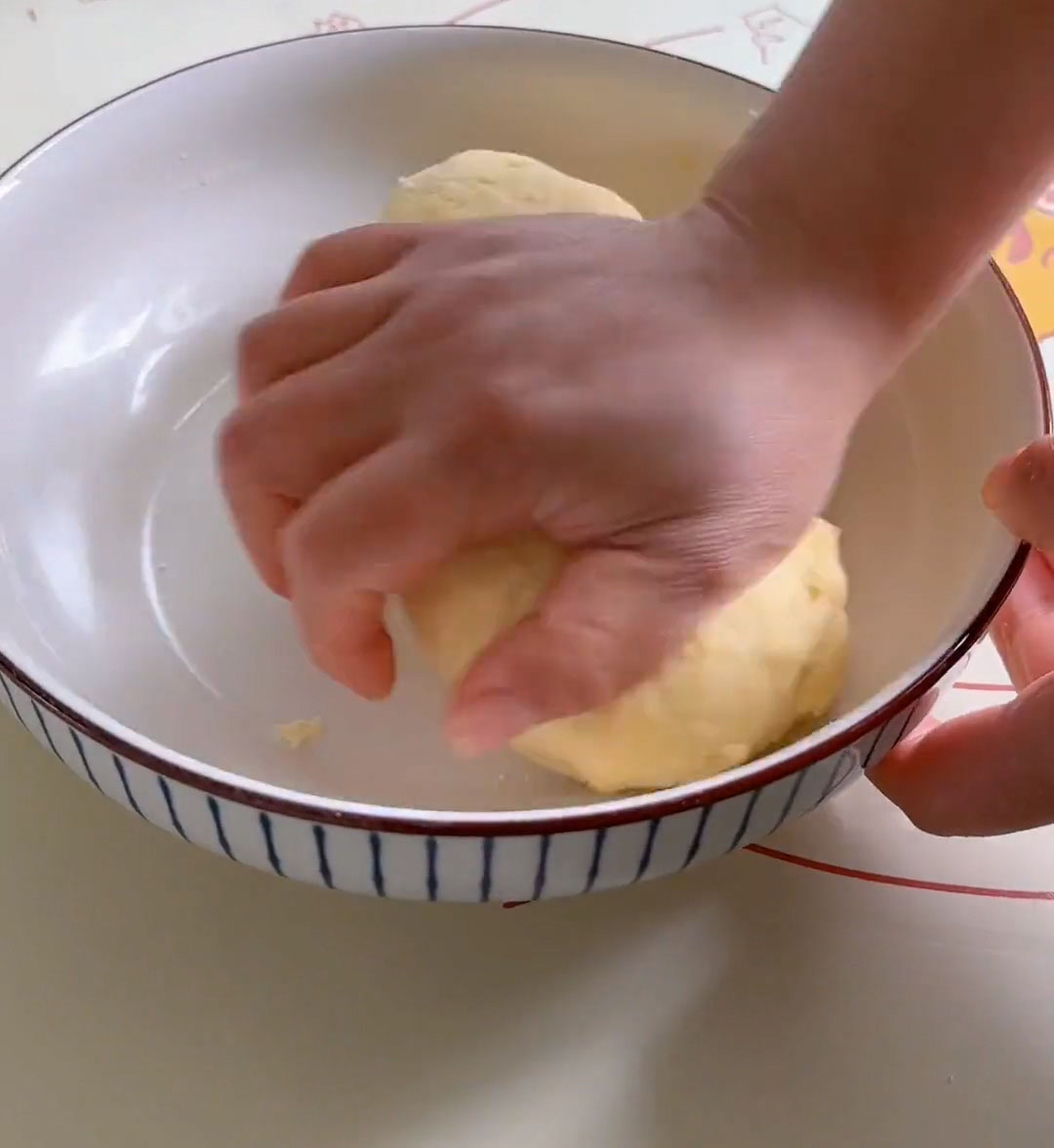 Begin kneading by hand in the bowl Begin kneading by hand in the bowl