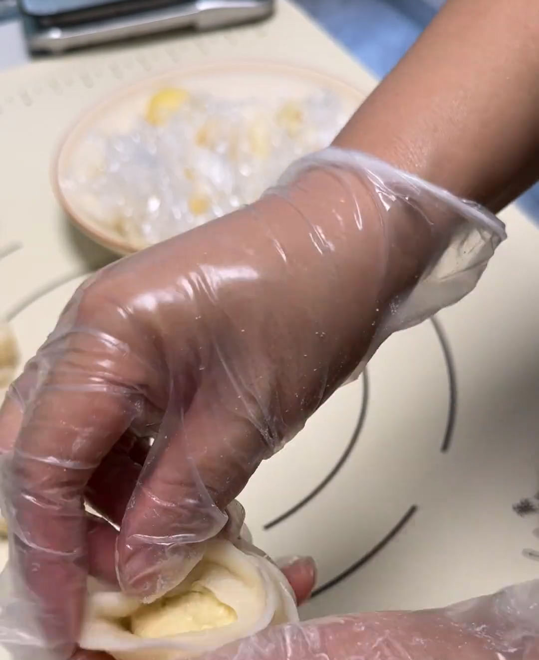 Carefully wrap the dough around the filling