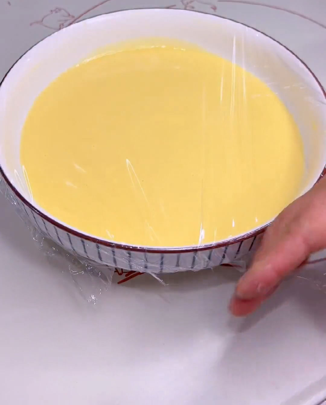 Cover the bowl with plastic wrap