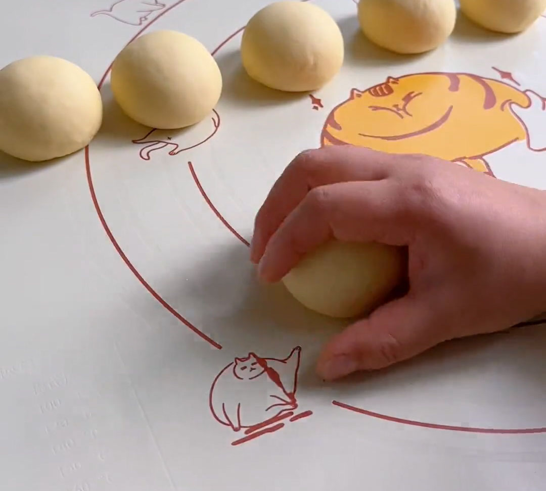 Cup your hand over the dough and move it in small, quick circular motions on the countertop, applying gentle downward pressure Cup your hand over the dough and move it in small, quick circular motions on the countertop, applying gentle downward pressure