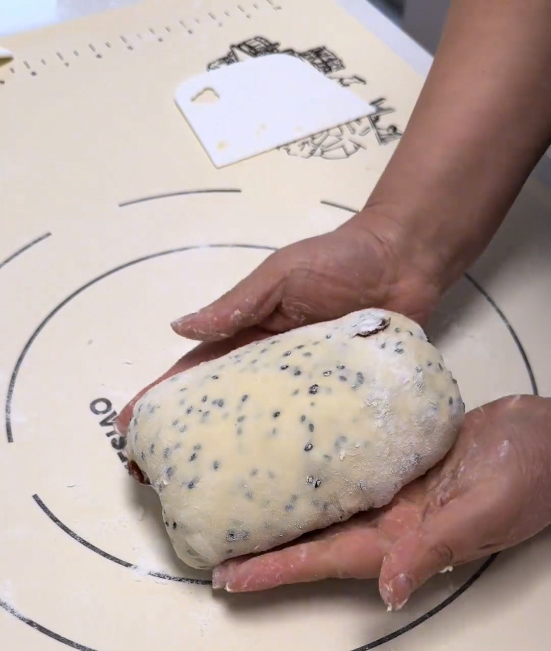 Flip the dough seam-side down so the smooth side faces up Flip the dough seam side down so the smooth side faces up