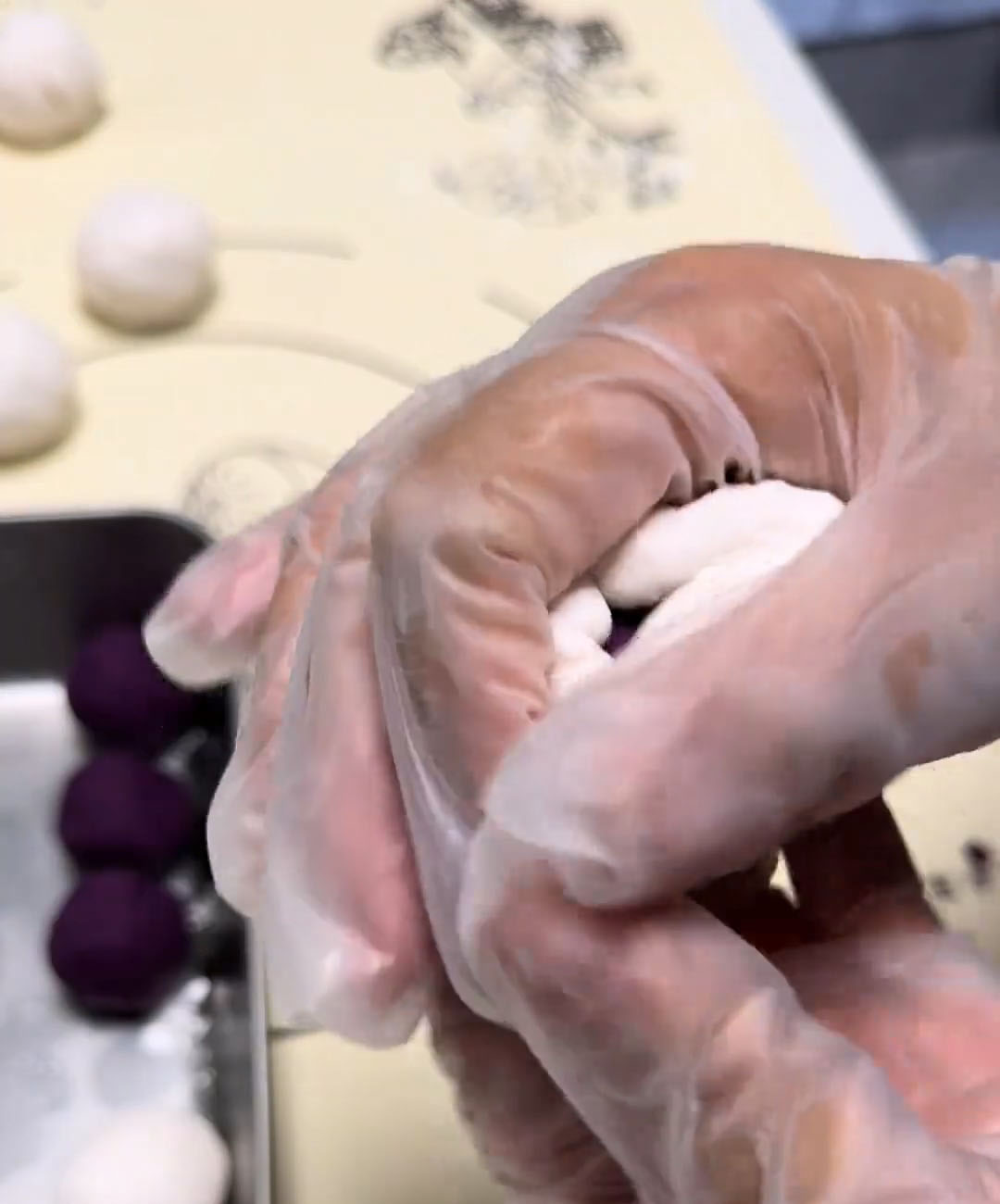 Gently bring the edges of the sago wrapper up and around the filling Gently bring the edges of the sago wrapper up and around the filling