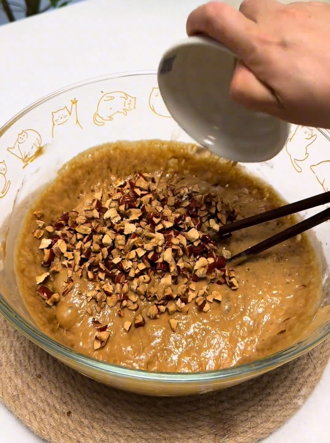 Gently stir the chopped red dates into the risen batter with your chopsticks