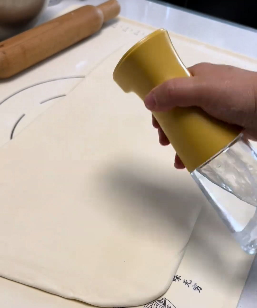 Lightly spray the surface with water