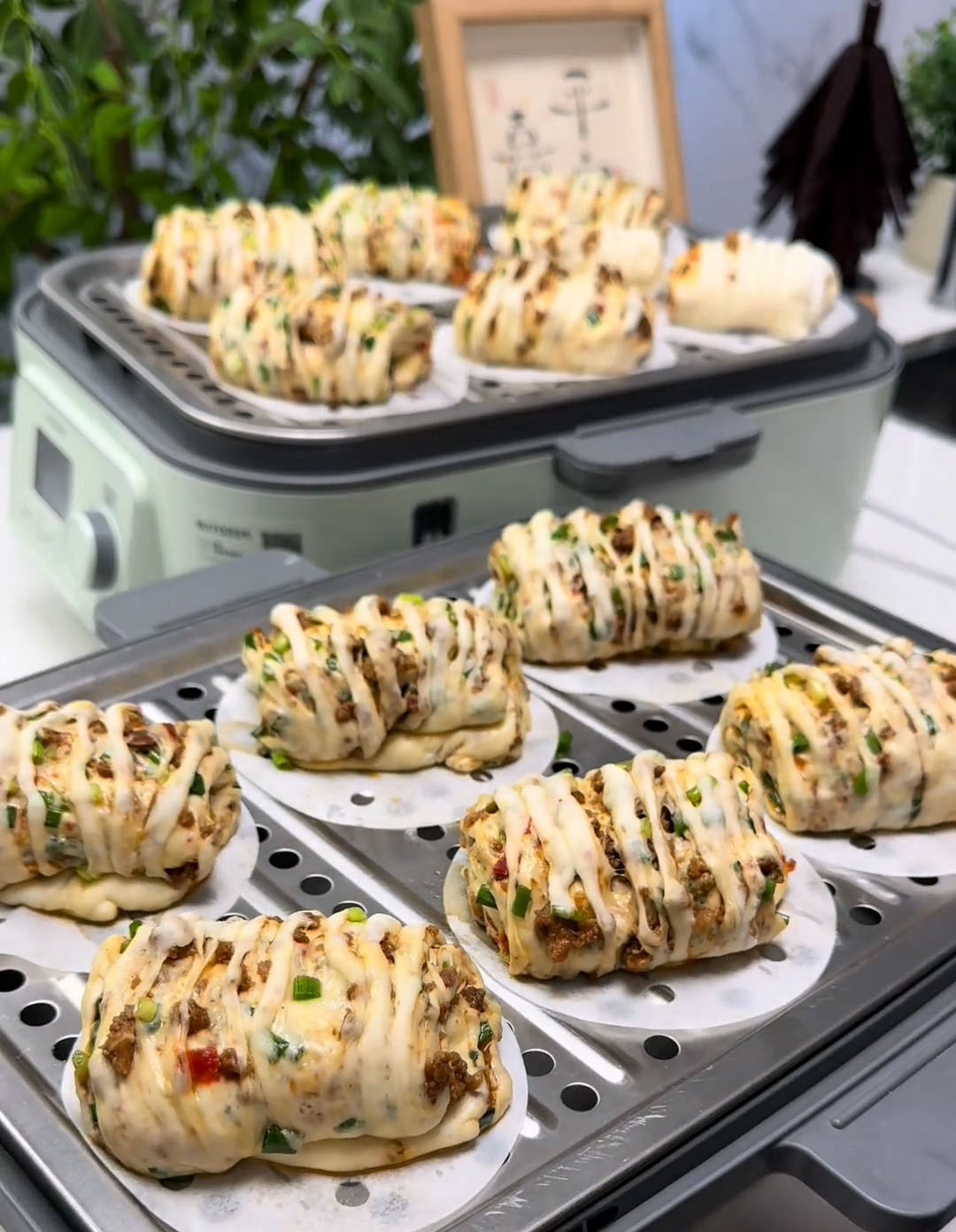 Place shaped buns on a steaming tray lined with a cloth