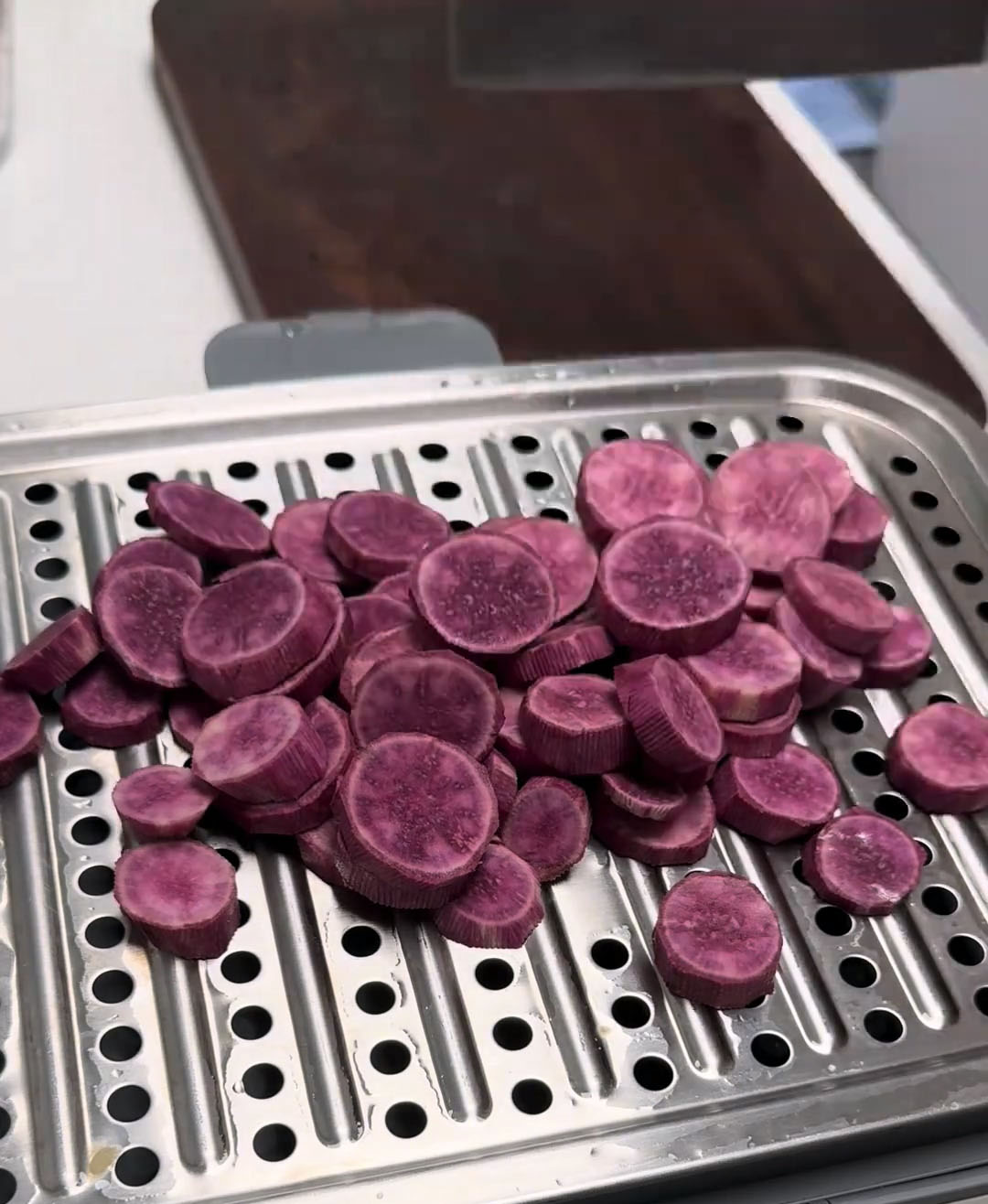 Place the slices in a steamer basket Place the slices in a steamer basket