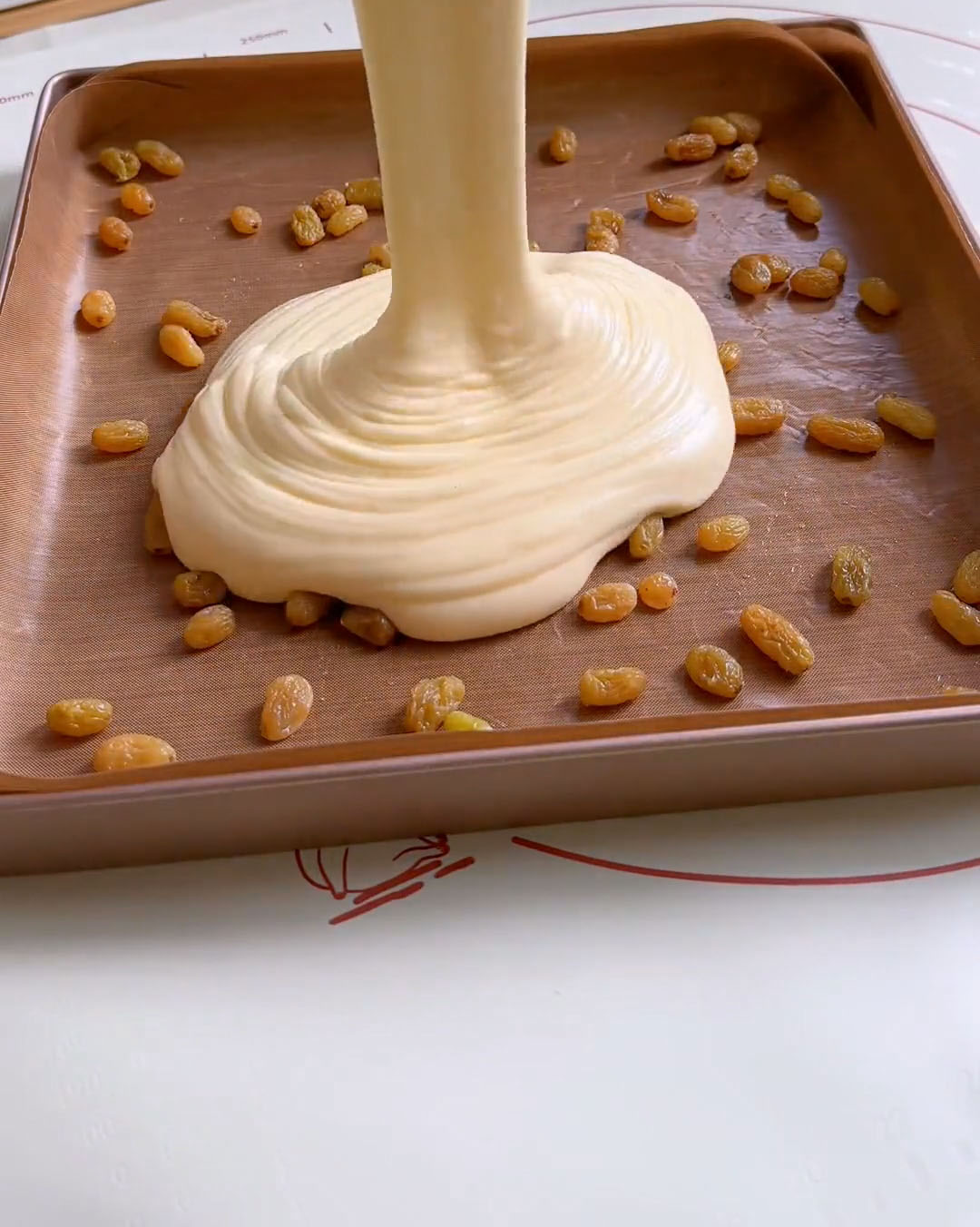 Pour the batter onto the tray