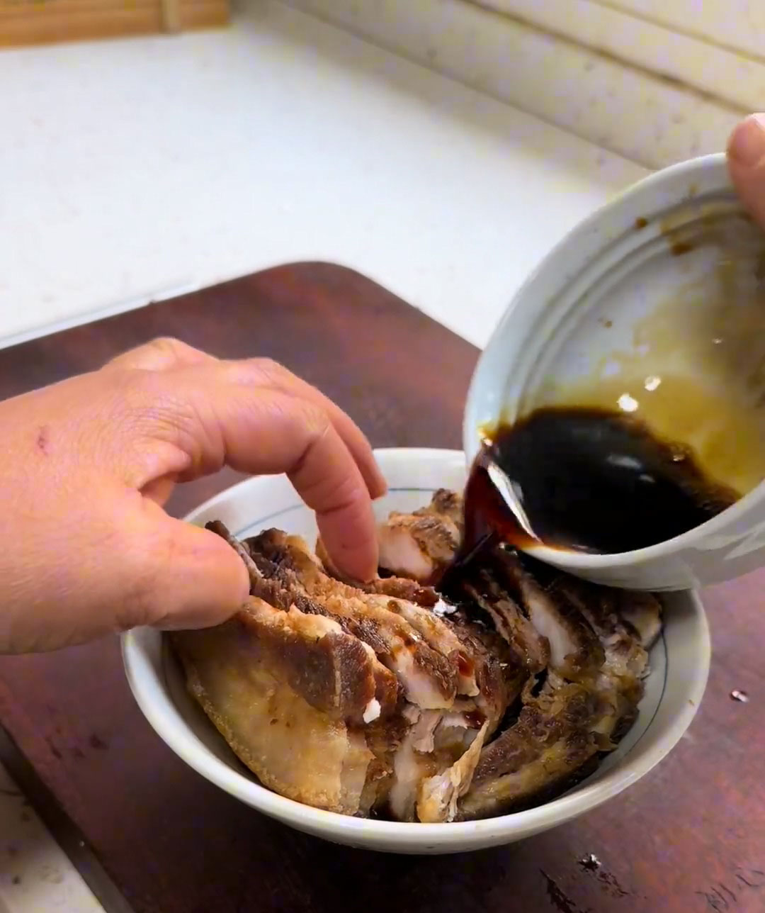 Pour the prepared sauce evenly over the pork