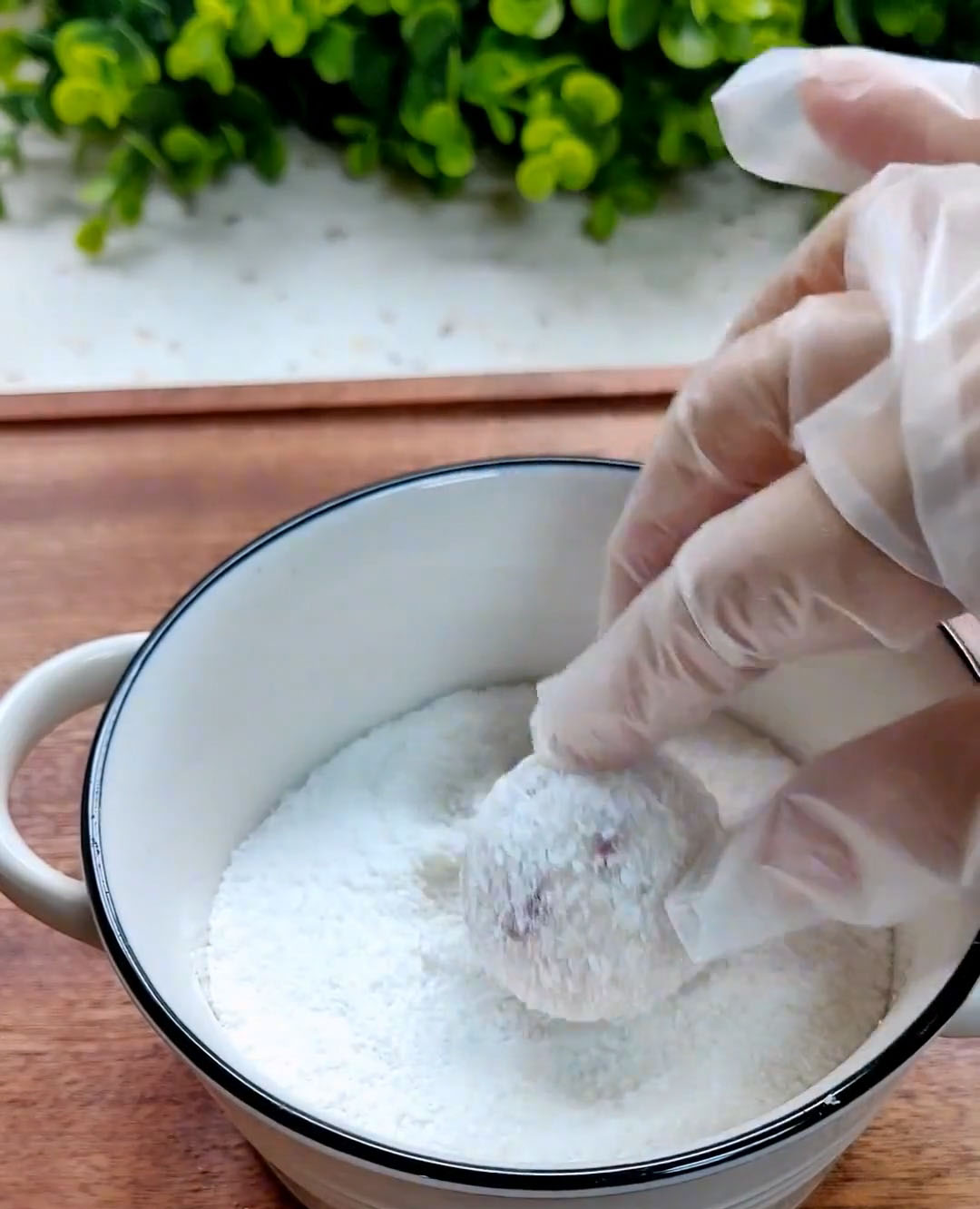 Roll each ball in the coconut