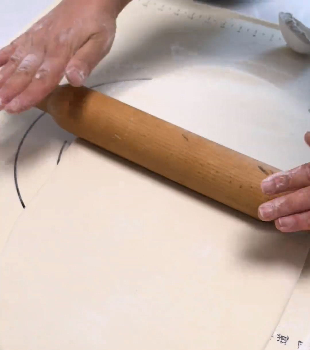 Roll the dough into a large thin sheet