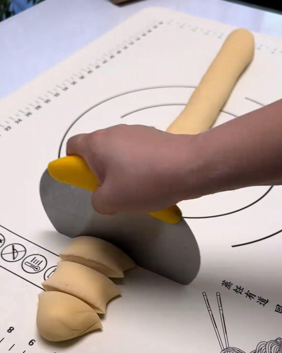 Roll the dough into a long log and divide it into 20 equal portions