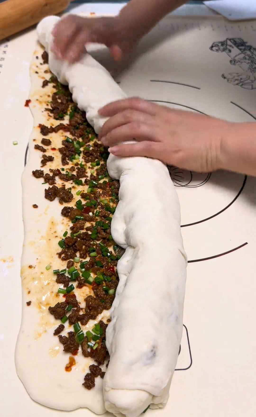 Roll the dough tightly from one end to the other