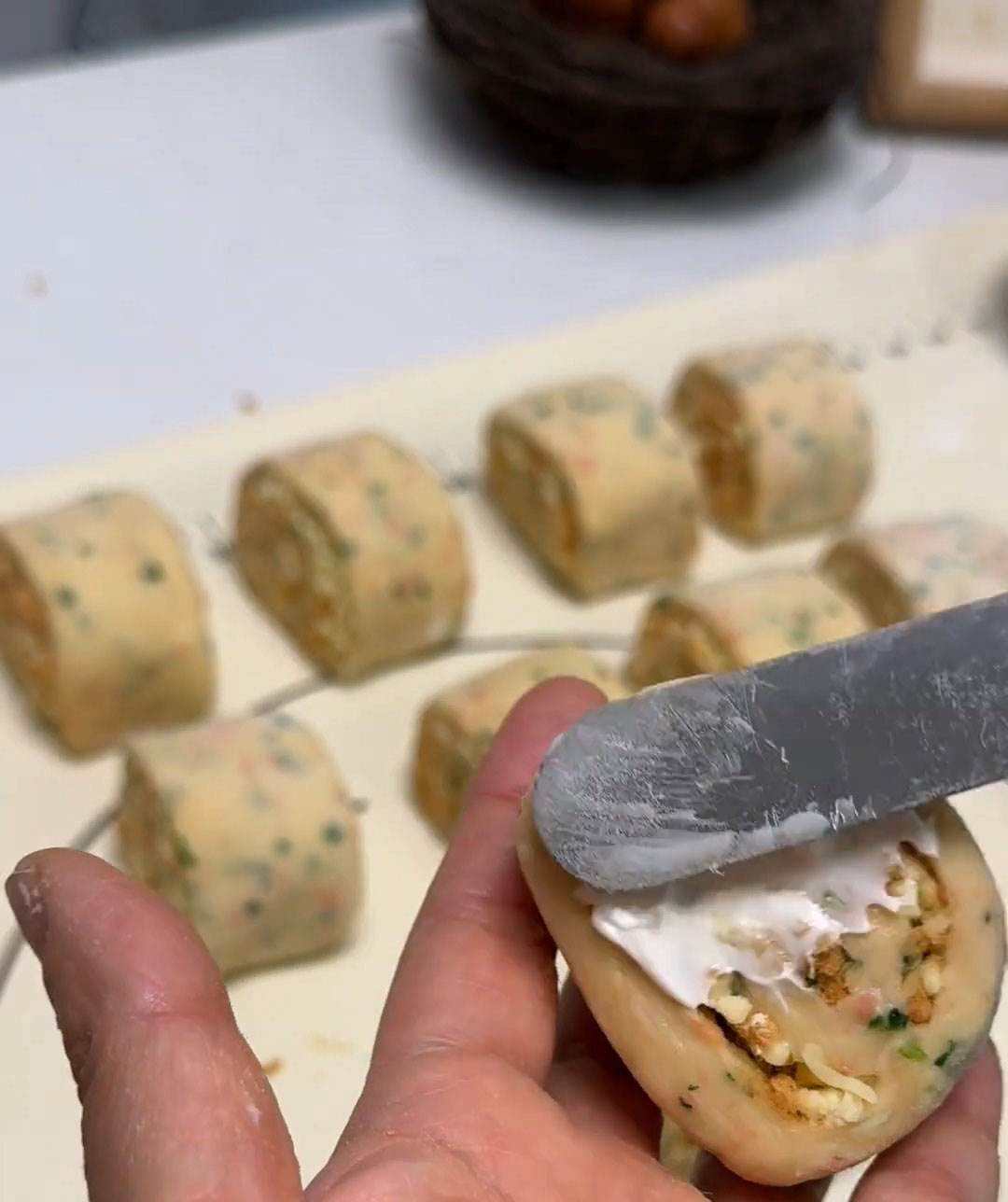 Spread a thin layer of salad dressing on the two cut sides of each roll Spread a thin layer of salad dressing on the two cut sides of each roll