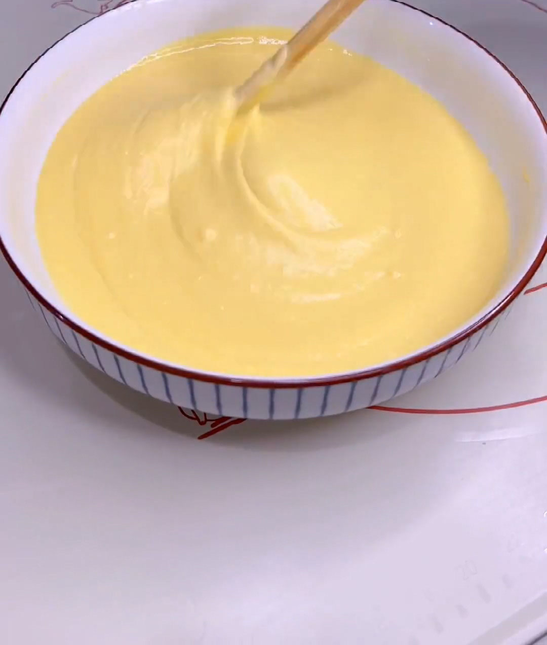 Stir with chopsticks or a whisk until a smooth, lump free batter forms