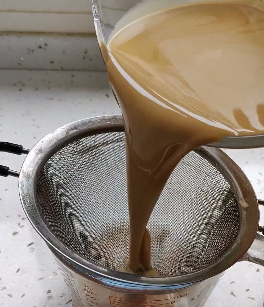 Strain the batter through a fine mesh sieve