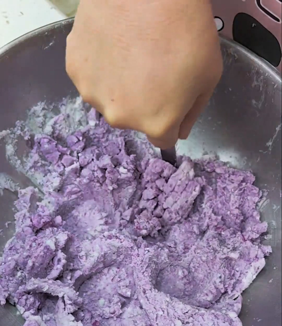 Use a potato masher or a fork to mash the taro
