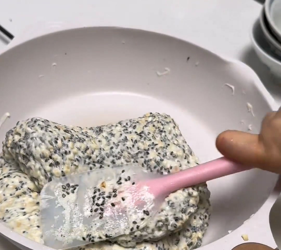 Use a silicone spatula to fold everything together until the nuts and seeds are evenly coated with the nougat