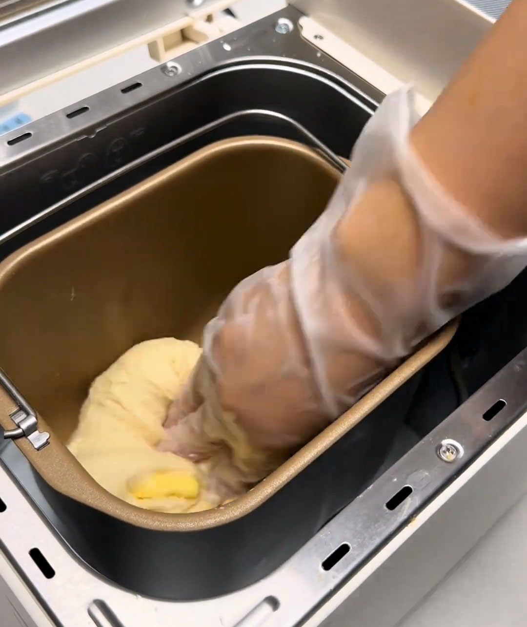 Use your hand to gently press and wrap the dough around the butter and salt