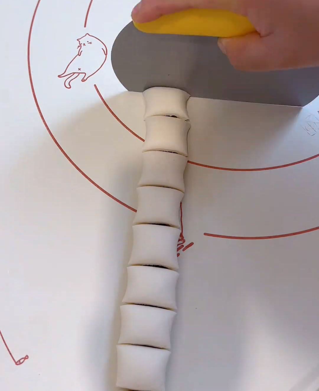 Using a scraper, cut into approximately 20 mini buns Using a scraper, cut into approximately 20 mini buns