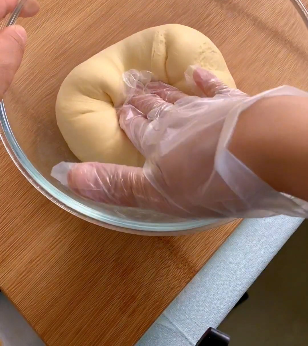 Using a stretch and fold motion — pulling the edges toward the center