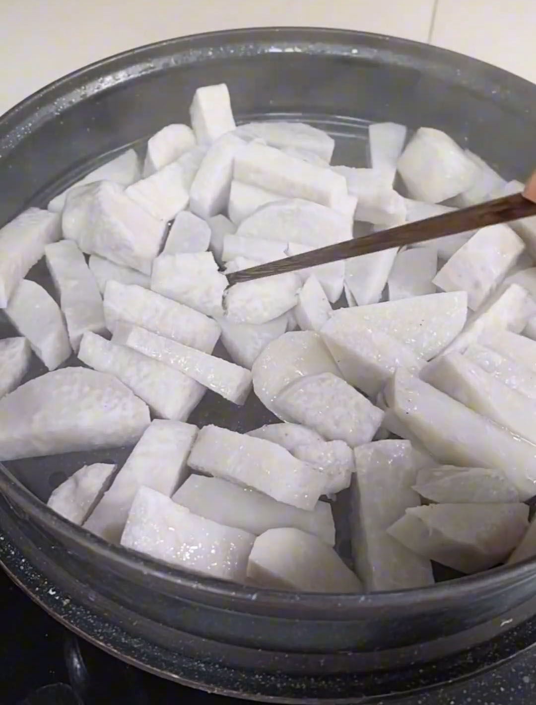 a chopstick pierces through the slices effortlessly