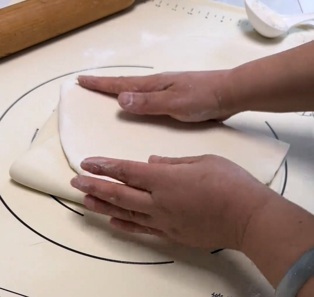 fold both ends toward the centre