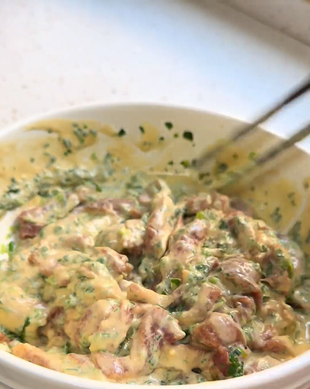 gently mix and fold until every single pork strip is uniformly and completely coated in the batter