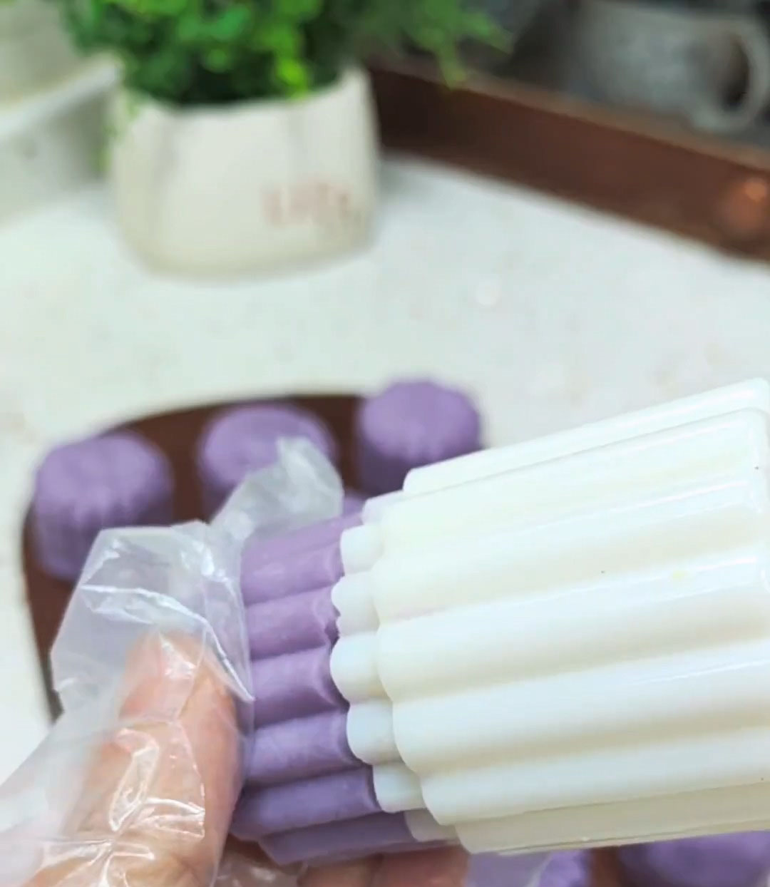 release and push the shaped mooncake out onto a plate or tray