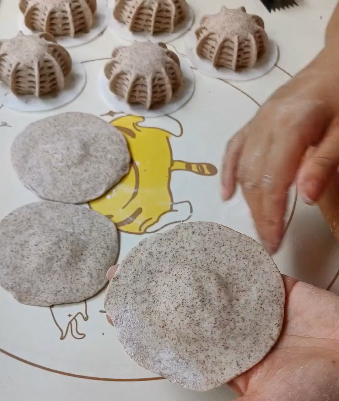 Take one piece of dough and use a rolling pin to flatten it into a round disc