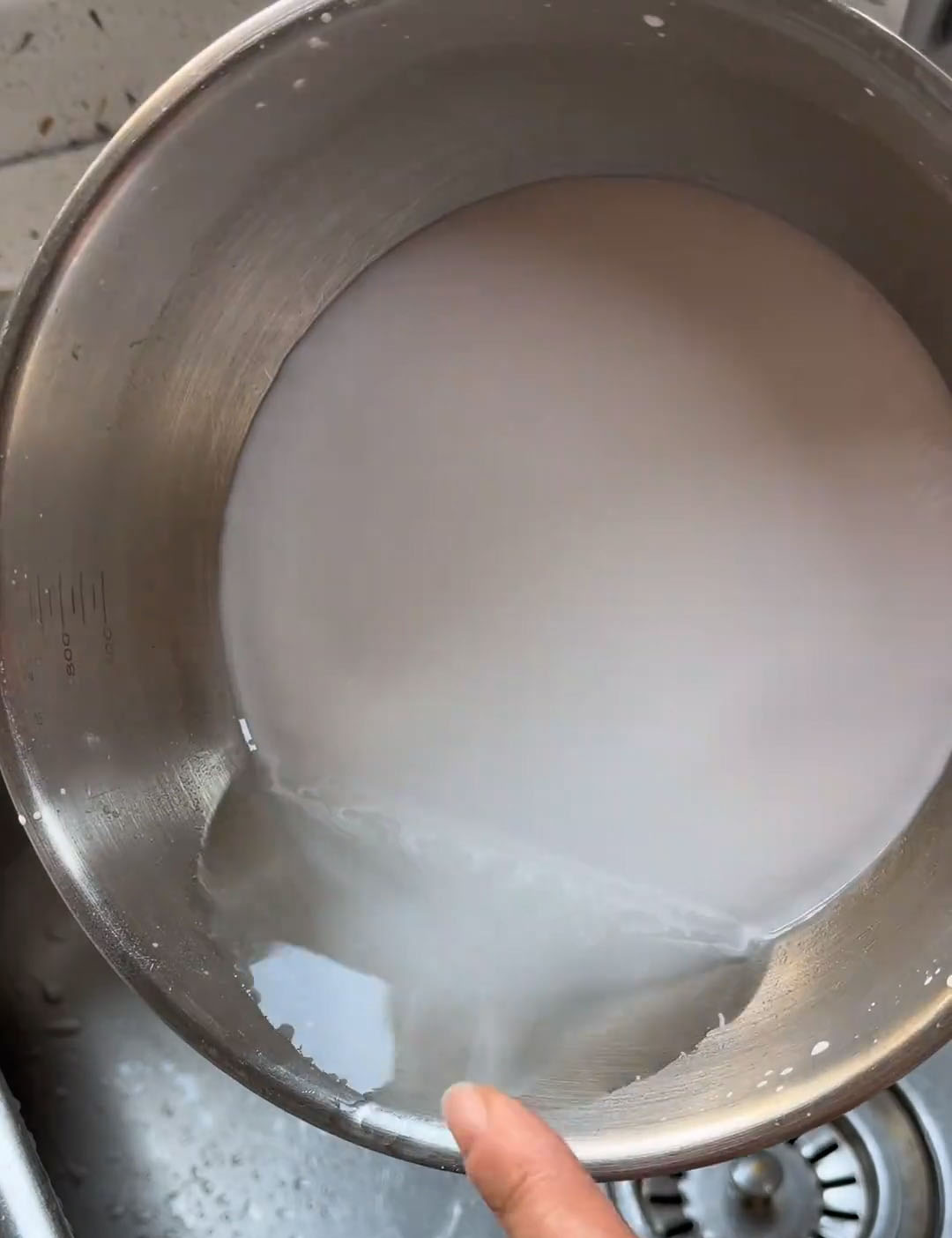 Carefully pour off the clear water on top