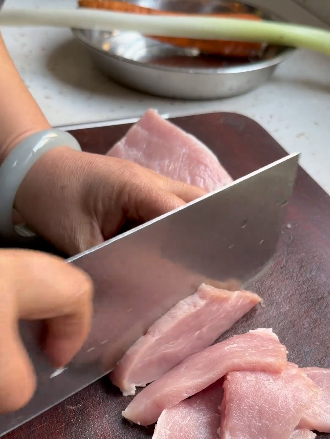 Slice diagonally into pieces about two coins thick