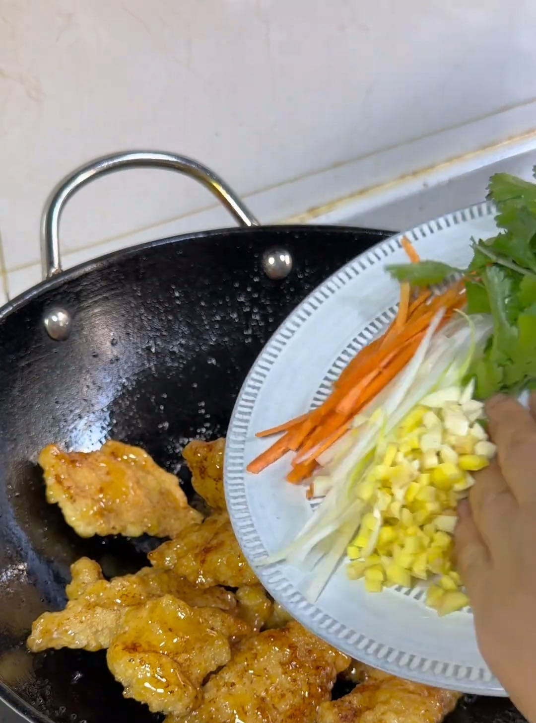 add the prepared ginger, garlic, scallions, and carrot